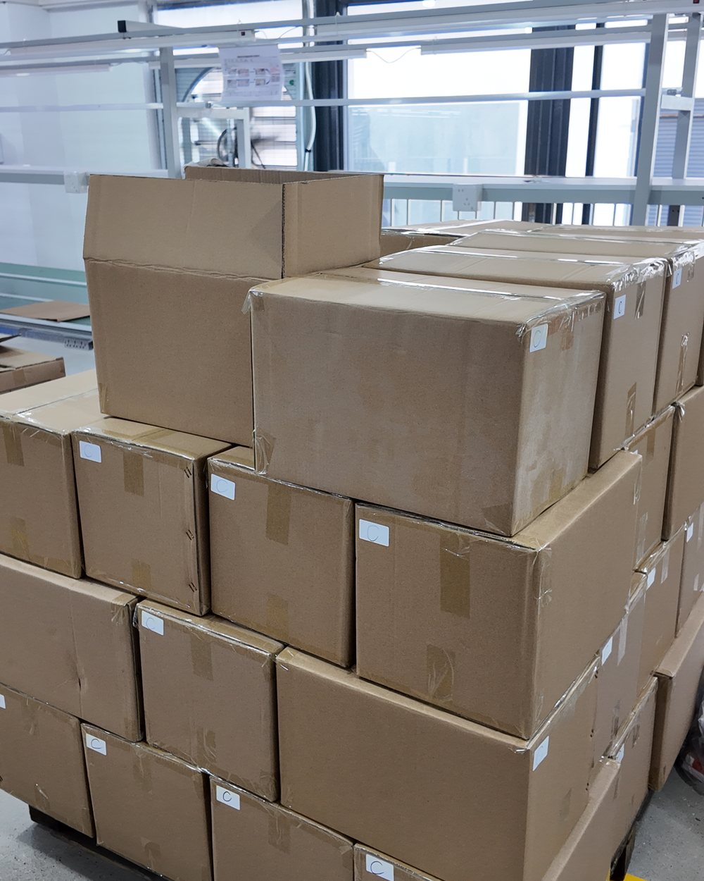 Cartons of packed brass parts staged ready for dispatch