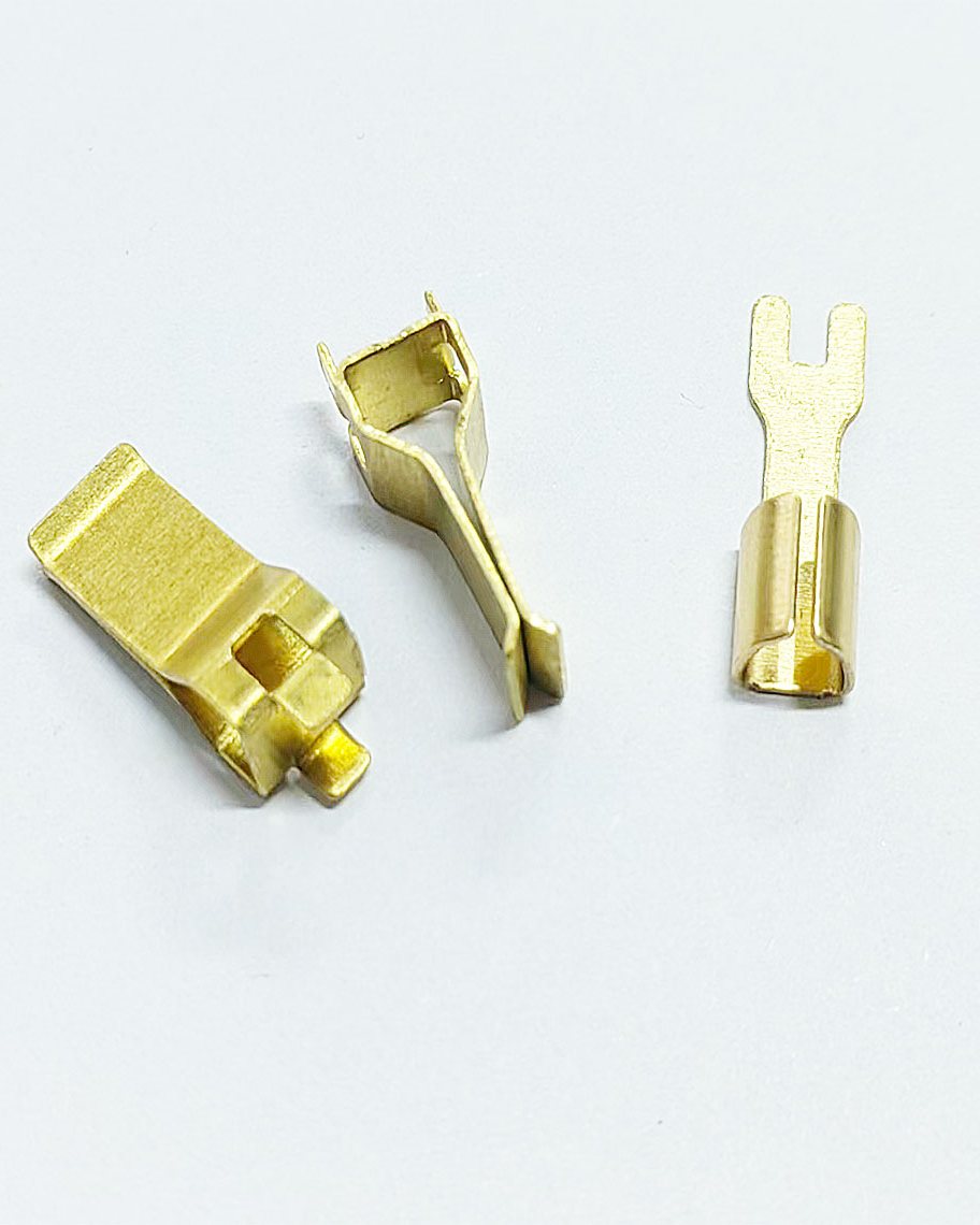 Brass terminals and formed contacts from a production batch, ready for dimensional check